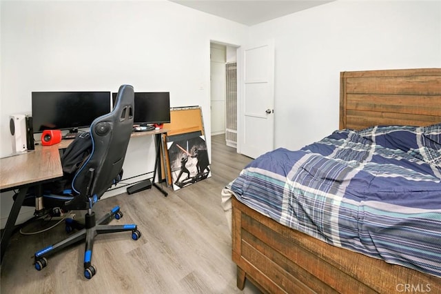 bedroom with light hardwood / wood-style floors