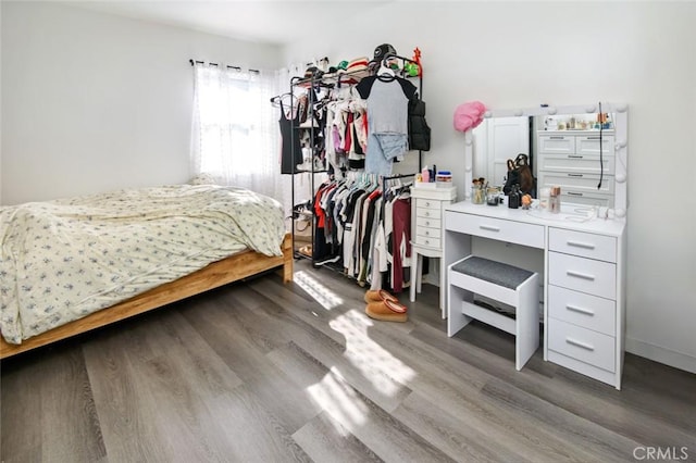 bedroom with hardwood / wood-style floors