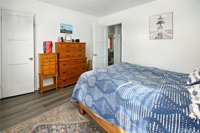 bedroom featuring dark wood-type flooring