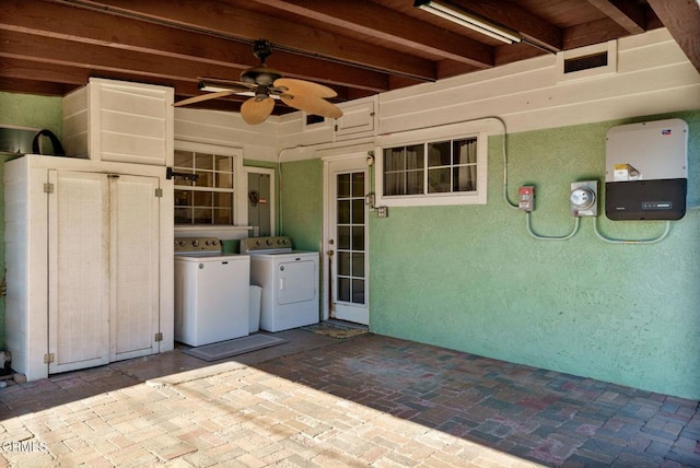 view of patio / terrace with ceiling fan and independent washer and dryer