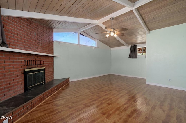 unfurnished living room with wood ceiling, ceiling fan, wood-type flooring, a fireplace, and vaulted ceiling with beams