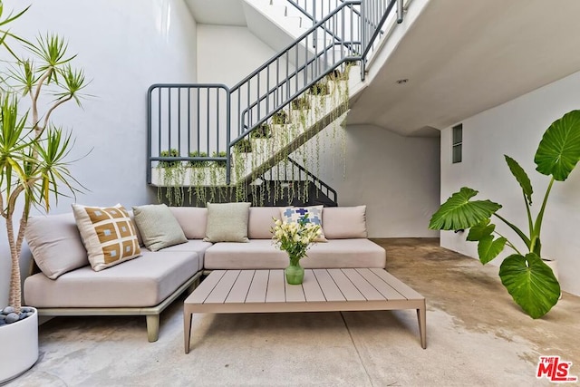 living room featuring concrete flooring