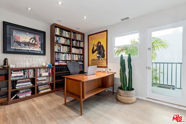 office area with light hardwood / wood-style flooring