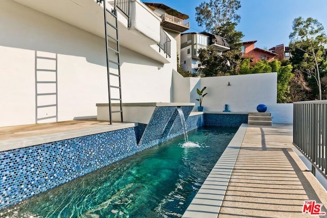 view of pool featuring pool water feature