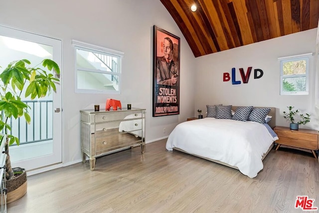 bedroom with wooden ceiling, light hardwood / wood-style flooring, and vaulted ceiling