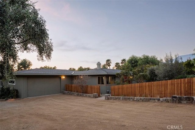 view of front of property featuring a garage