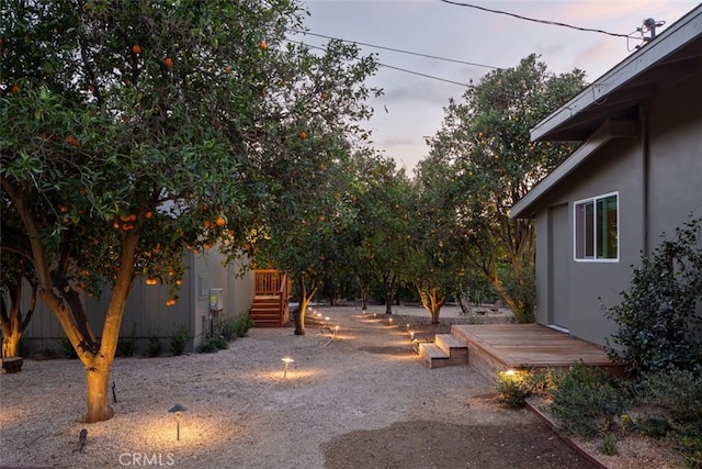 view of yard at dusk