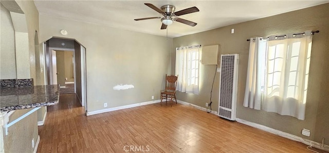 spare room with ceiling fan and light hardwood / wood-style floors