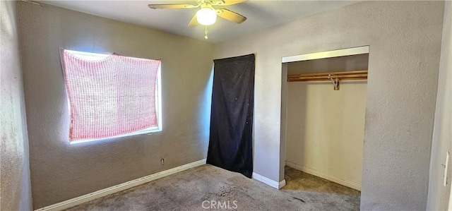 unfurnished bedroom featuring light colored carpet, ceiling fan, and a closet