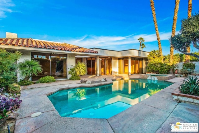 view of pool featuring a sunroom and a patio