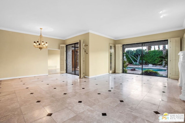 spare room with crown molding and an inviting chandelier