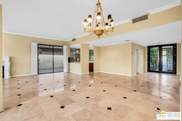 unfurnished living room featuring a wall of windows, crown molding, french doors, and a notable chandelier