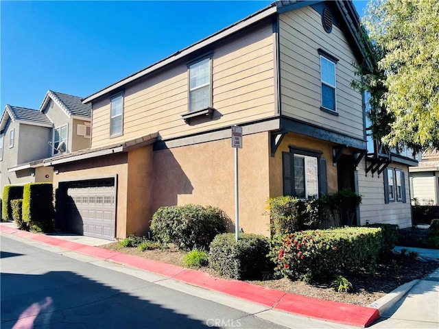 view of property exterior with a garage