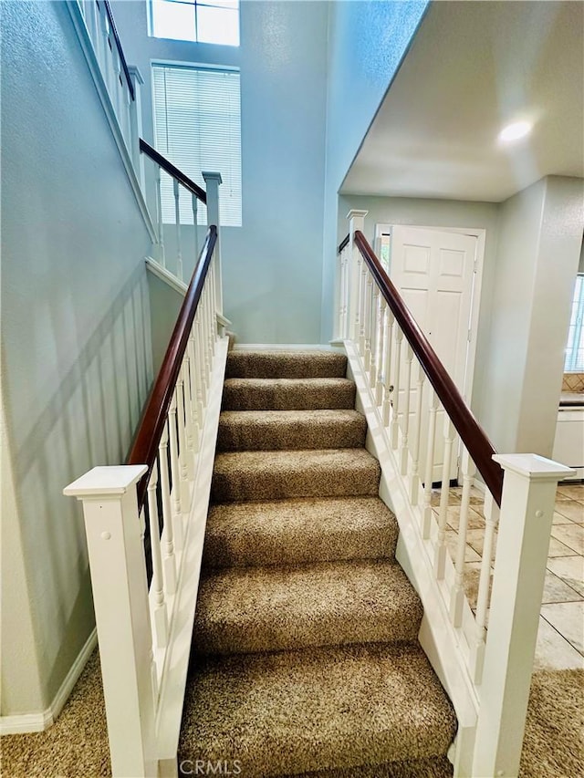 staircase featuring a healthy amount of sunlight