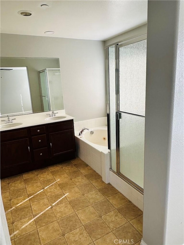 bathroom with vanity and plus walk in shower