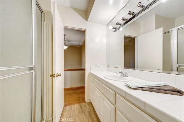 396 S Miraleste Dr Unit 512, San Pedro, CA 90732 - bathroom with vanity, a shower stall, and wood finished floors