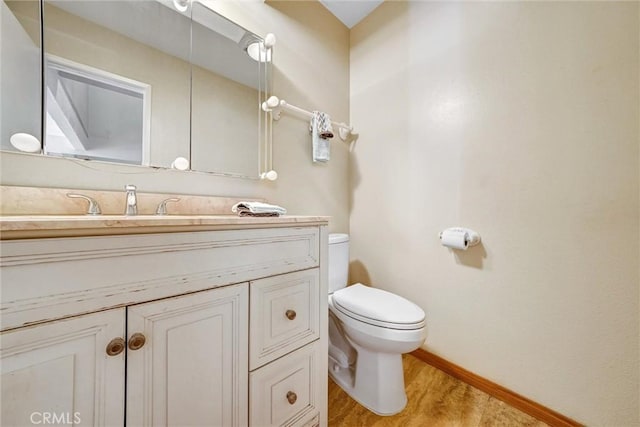 396 S Miraleste Dr Unit 512, San Pedro, CA 90732 - bathroom featuring wood finished floors, vanity, toilet, and baseboards