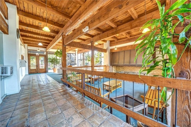 396 S Miraleste Dr Unit 512, San Pedro, CA 90732 - interior space with french doors, wood ceiling, stone tile flooring, cooling unit, and beam ceiling