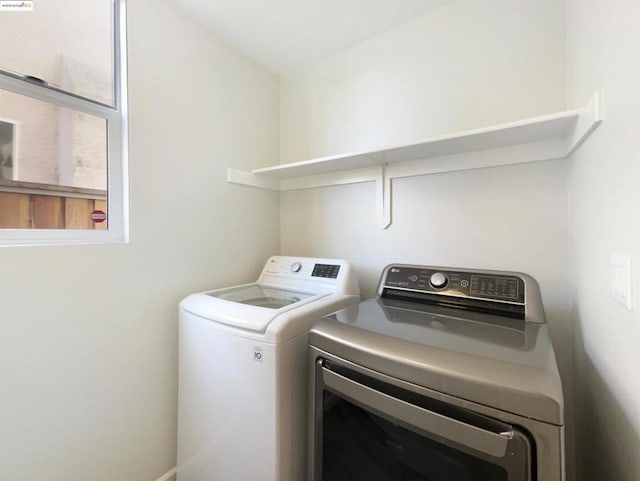 laundry area with washing machine and clothes dryer