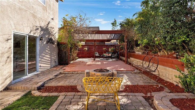 view of patio / terrace featuring a fire pit