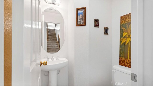 bathroom featuring toilet