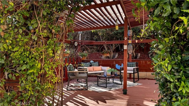 deck featuring a pergola and outdoor lounge area