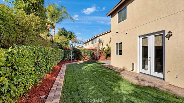 view of yard with french doors