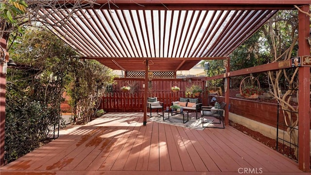 wooden terrace featuring a pergola, an outdoor hangout area, and a fenced backyard