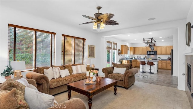 living area featuring recessed lighting and a ceiling fan