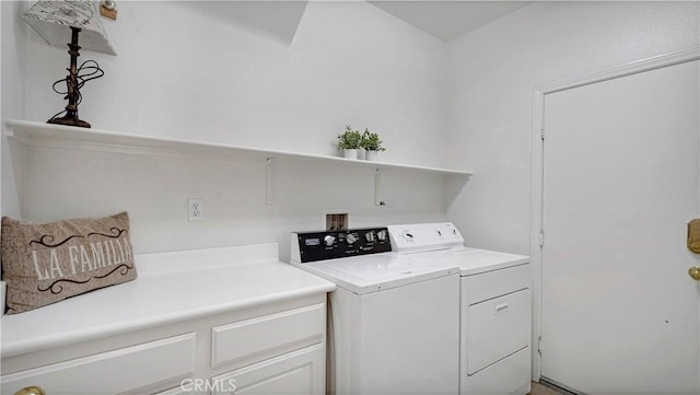 washroom with separate washer and dryer and laundry area