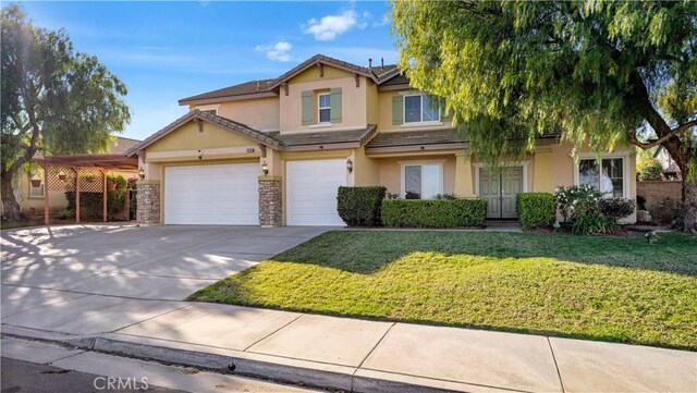 view of front of home with a front yard, a garage, and a carport