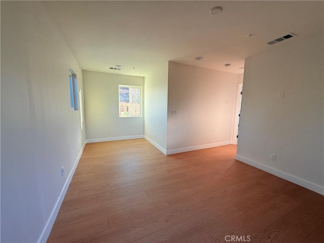 unfurnished room with light hardwood / wood-style flooring