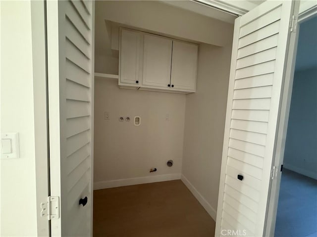 clothes washing area with gas dryer hookup, cabinets, and washer hookup