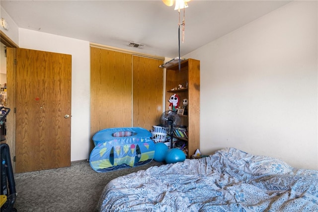 carpeted bedroom featuring a closet