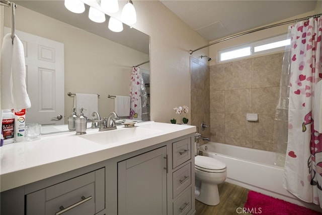 full bathroom with shower / bath combo, toilet, wood-type flooring, and vanity