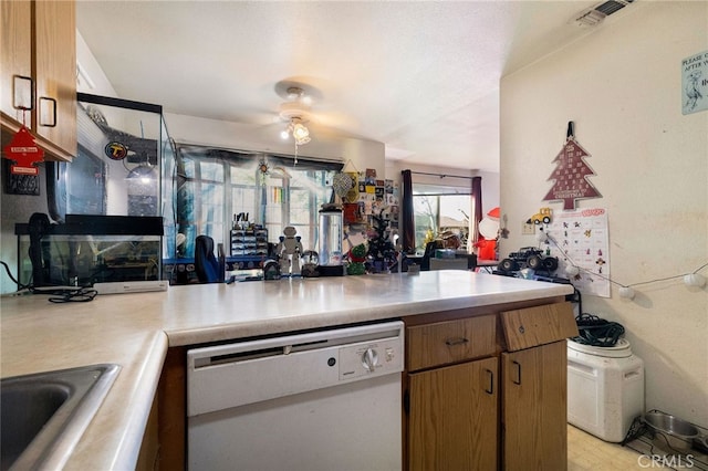 kitchen with white dishwasher, ceiling fan, kitchen peninsula, and sink