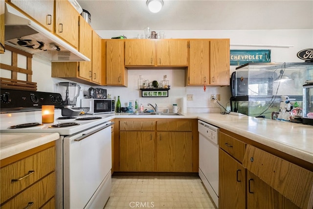 kitchen with sink and white appliances