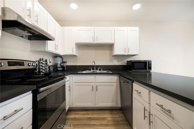 kitchen featuring white cabinetry, sink, stainless steel appliances, and dark hardwood / wood-style floors