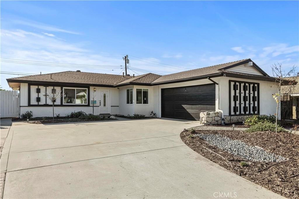 ranch-style house featuring a garage