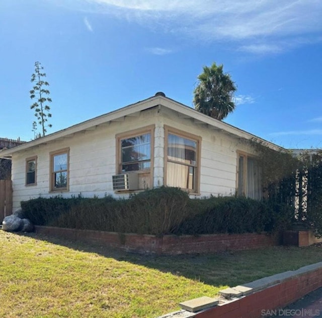 view of home's exterior featuring a lawn