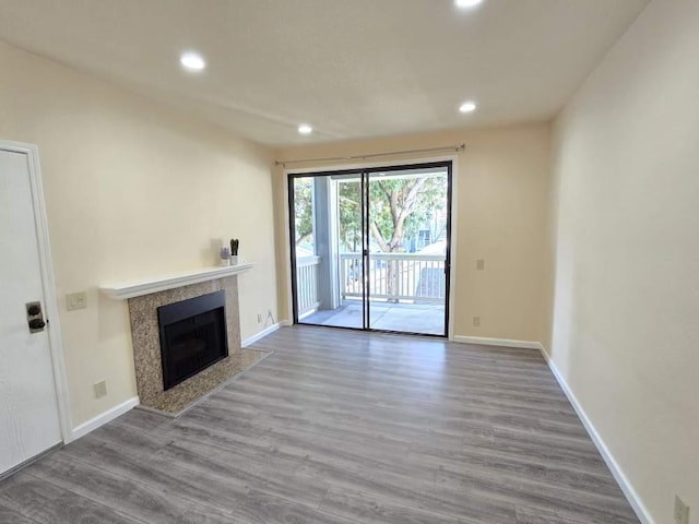 unfurnished living room featuring wood-type flooring