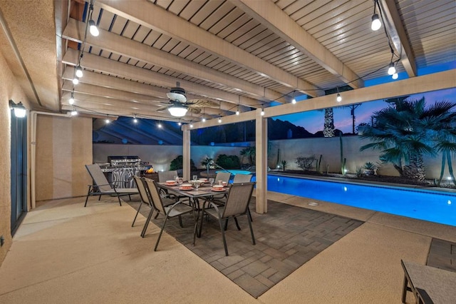 view of swimming pool with ceiling fan and a patio