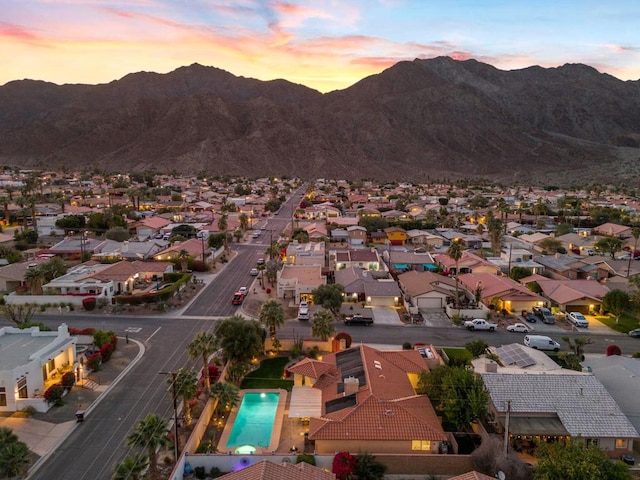 aerial view at dusk with a mountain view