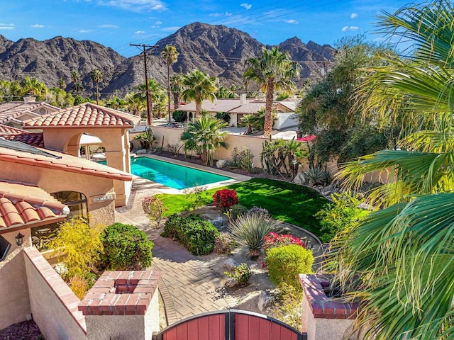 view of pool with a patio area, a mountain view, and a gazebo