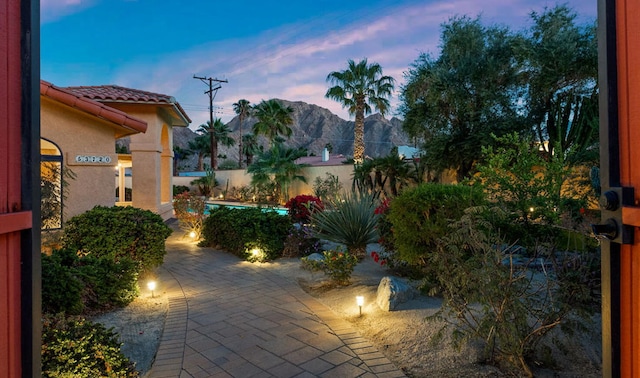 patio terrace at dusk with a mountain view