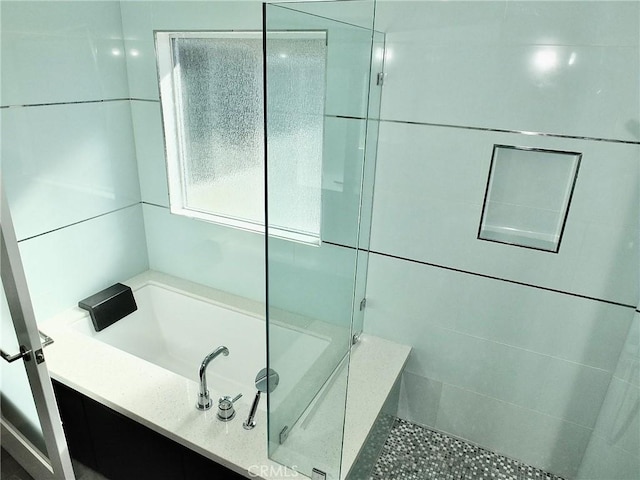 bathroom with independent shower and bath