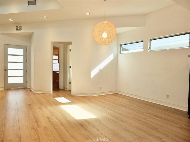 empty room with light hardwood / wood-style floors