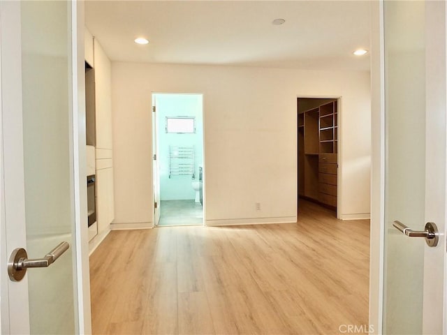 spare room with light hardwood / wood-style floors