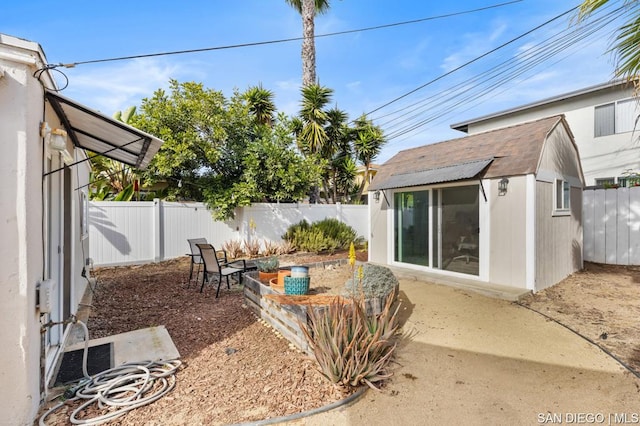 view of patio / terrace with an outbuilding