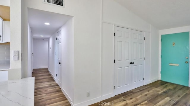 hall with dark hardwood / wood-style floors